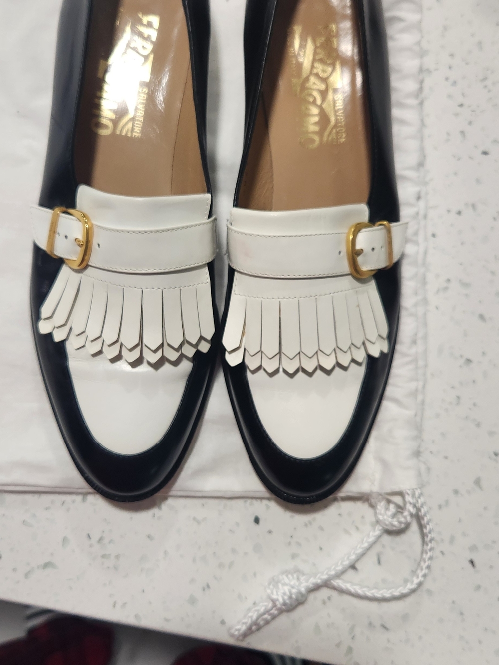 Salvatore Ferragamo Black and White Kiltie Fringe Loafers with Gold Buckle